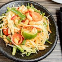 Som Tum · Gluten free. Green papaya with cherry tomatoes and green beans, topped with peanuts.