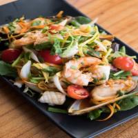 Yum Talae · Prawns, calamari, mussels, and scallops with onions and cilantro in a spicy lime dressing se...