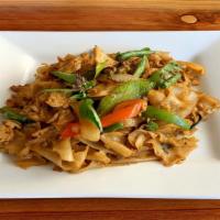 Pad Kee Mao · Gluten free. Semi-spicy stir-fried wide rice noodle with bell peppers, onions, green beans, ...