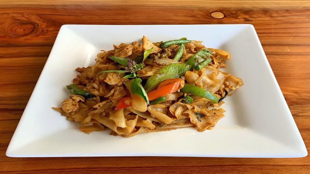 Pad Kee Mao · Gluten free. Semi-spicy stir-fried wide rice noodle with bell peppers, onions, green beans, peppercorn, kaffir leaves, and thai basil.