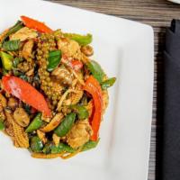 Pad Cha · Gluten free. Spicy stir-fry with bell peppers, baby corn, mushrooms, young finger root, pepp...