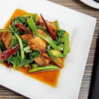 Kana Moo Grob · Gluten free. Chinese broccoli, crispy pork belly, and roasted peppers stir-fried in house Sa...