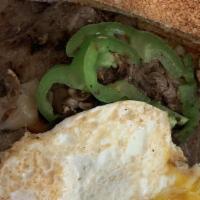 Steak & Egg Breakfast · Thin sliced marinated steak cooked with grilled onions on top. Three eggs, hash brown and wh...
