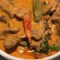 Red Curry · Choice of chicken, beef or pork with bamboo shoot in red curry and coconut milk.