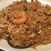 Seafood Fried Rice · Fried rice with shrimp, fish scallop, squid, green mussels, and egg.