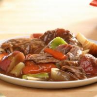 Braised Beef With Vegetables & Gravy · Slow roasted beef and vegetables smothered with gravy.