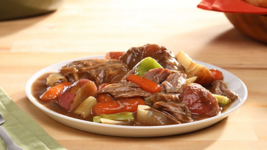 Braised Beef W/ Vegetables & Gravy · Slow roasted beef and vegetables smothered with gravy.