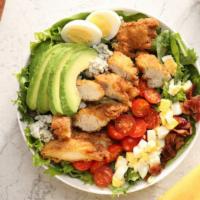 Chicken Cobb Salad · Mixed greens topped with Chicken, chopped bacon, egg, avocado, and cherry tomatoes, with cho...