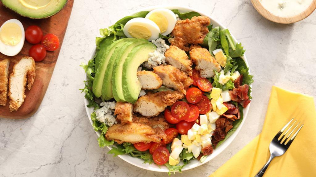 Chicken Cobb Salad (Grilled) · Mixed greens topped with Grilled Chicken, chopped bacon, egg, avocado, and cherry tomatoes, with choice of ranch, vinaigrette, or blue cheese dressing.