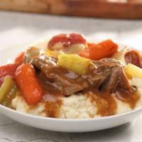 Braised Beef And Vegetable Bowl · Slow roasted beef and vegetables smothered with gravy and served over mashed potatoes.