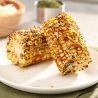 Grilled Cajun Corn-On-The-Cob · Grilled corn cobbettes dusted with Cajun seasoning and sprinkled with shredded parmesan chee...