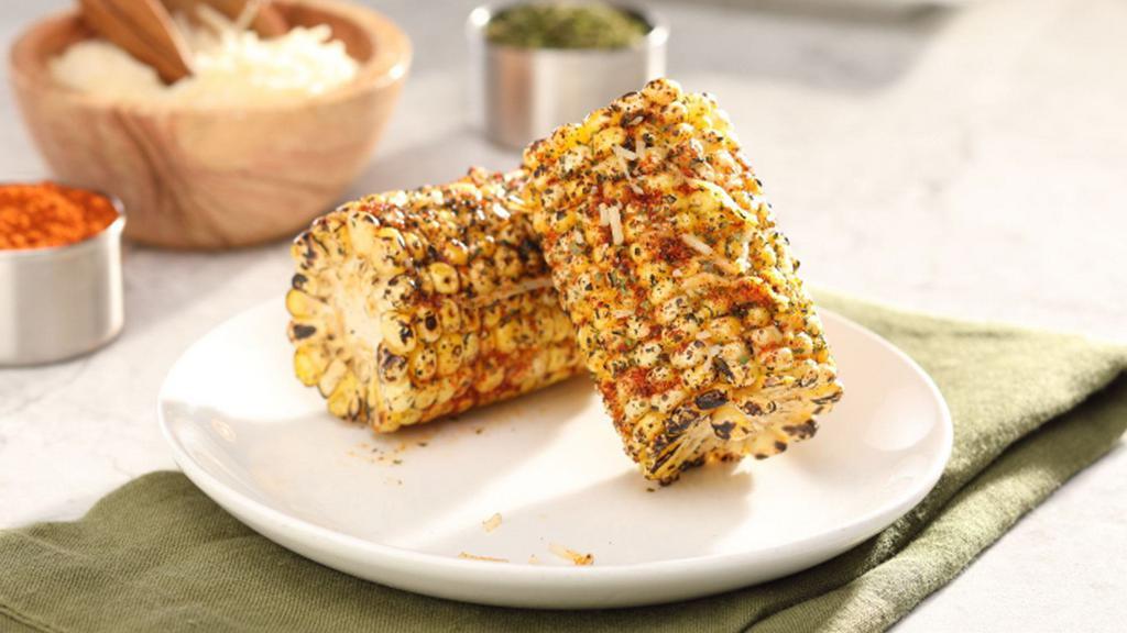 Grilled Cajun Corn-On-The-Cob · Grilled corn cobbettes dusted with Cajun seasoning and sprinkled with shredded parmesan cheese.
