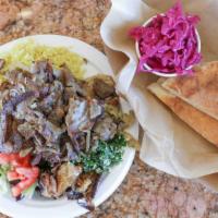 Lamb Gyros Plate · Lamb Gyro Meat with Grilled onions, Salad, Rice, 1 PIta & 2 sides.