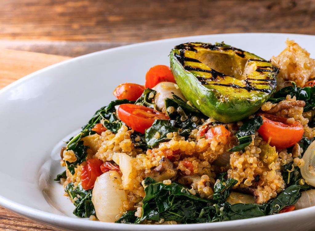 Quinoa Bowl · Spinach, blistered tomatoes, seasonal vegetables, grilled avocado, served warm.