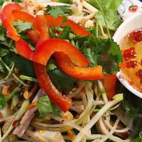 Goi Xoai Oc Huong · Green mango tossed with periwinkle.