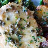 Chicken Picatta · Lemon caper white wine sauce, blistered tomatoes, herb roasted potatoes, sautéed broccoli, a...
