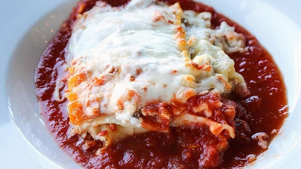 Lasagna · Layers of pasta, meat sauce, ricotta & melted mozzarella cheese.