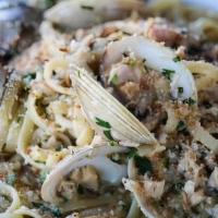 Linguini With Clams · Tossed in garlic & evo.