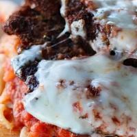 Chicken Parmigiana · Thinly pounded chicken breast, panko crust, and marinara sauce topped with melted mozzarella...