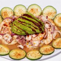 Special Platter · Cooked shrimp, shrimp cured in lime juice, octopus, scallops, slices cucumber,  red onion, a...