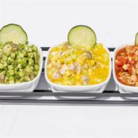 Ceviche Trio · Shrimp cooked in lime juice in three different styles (Altata style, black sauce ceviche and...