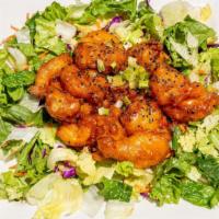 Rock Shrimp · Tempura fried shrimp, served over a coat of carrots and onion ajonjoli, chipotle salsa, and ...
