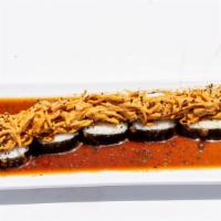 Kanikama Roll · In: Tempura shrimp, crab mix, avocado and Philadelphia, rolled in seaweed.
Out: Topped with ...