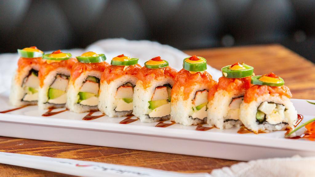Spicy Tuna Roll · In: Philadelphia, avocado, imitation crab. Out: Spicy tuna, jalapeño slices, chipotle dressing, sriracha. Served on a eel sauce and sesame seed bed.