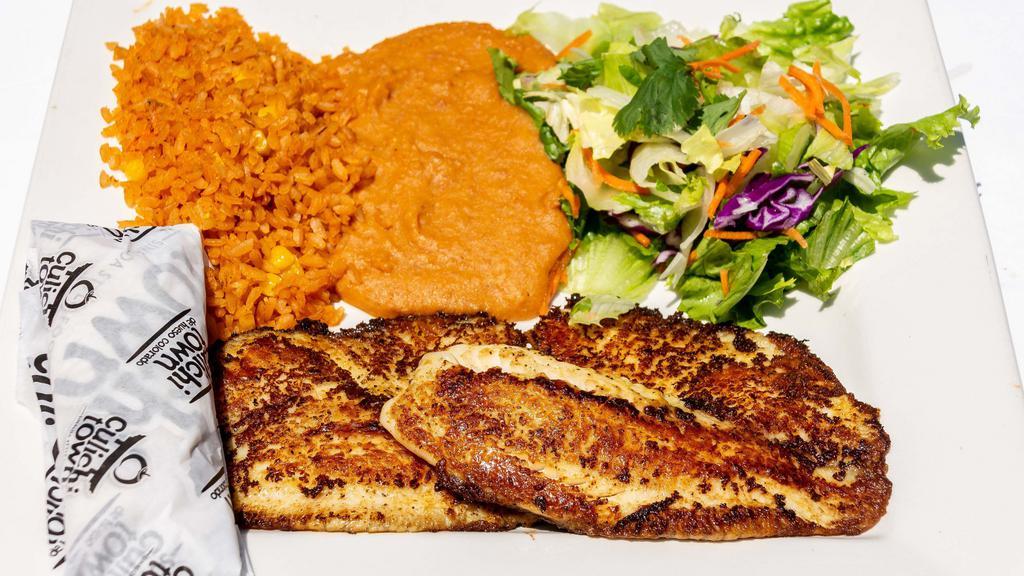 Zarandeado Fish Fillet · Zarandeado fish fillet served with rice, beans, and salad.