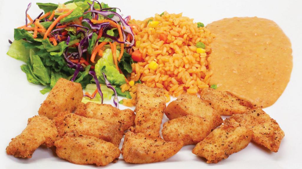 Fish Cracklings · Fish cracklings served with beans, rice, and salad.