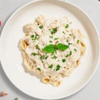 Fettuccine Alfredo · Fresh fettuccine pasta served with a creamy alfredo sauce and your choice of toppings.