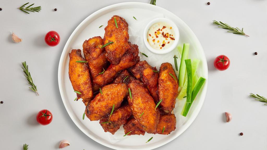 Chicken Wings · Six or twelve chicken wings with your choice of sauce.