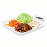 Asian Lettuce Wraps · Crisp lettuce with minced chicken, mushroom, water chestnuts and green onions. Garnish with ...