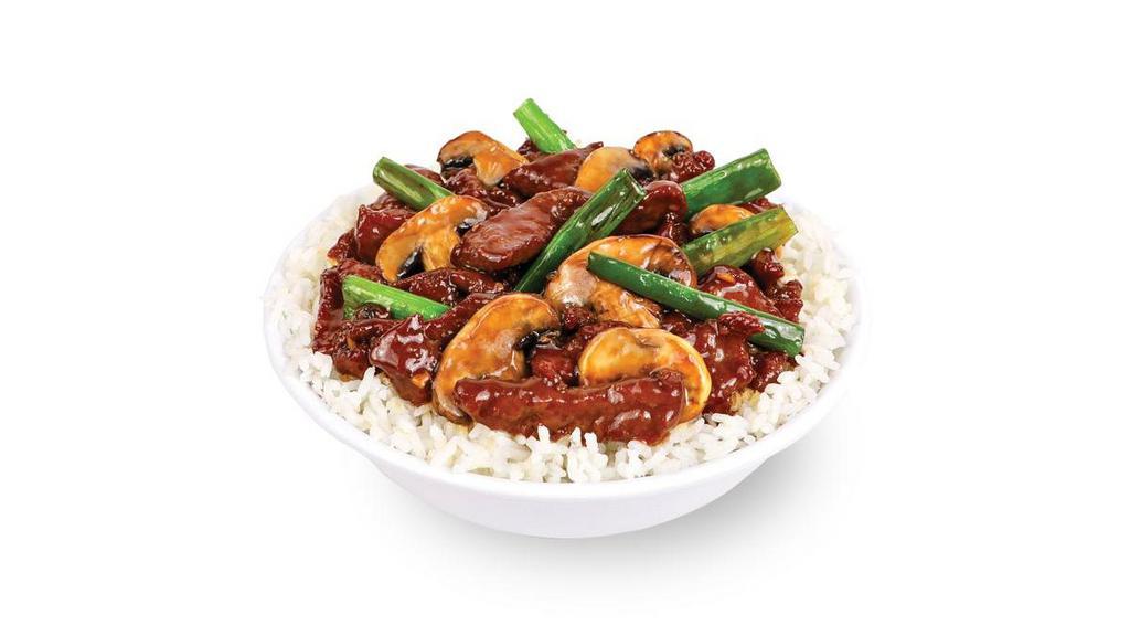 Mongolian Steak · Gluten Free - Grass-fed, wok seared steak with garlic, scallions, and mushrooms. Tossed in a rich and sweet soy sauce.