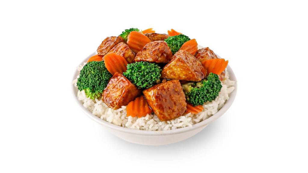 Teriyaki Tofu · Crispy Tofu with broccoli and carrots in a sweet soy teriyaki sauce.