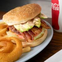 Bacon Avocado Burger · Made with dressing, onion, tomato, and pickles.