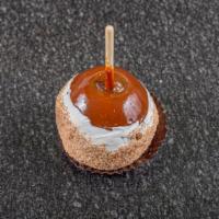 Apple Pie Apple™ · Caramel-covered granny smith apple dipped in white confection, rolled in brown sugar and cin...