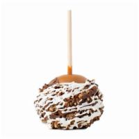 Pecan Bear™ Apple · Caramel-covered Granny Smith green apple rolled in crushed pecans, drizzled with milk chocol...
