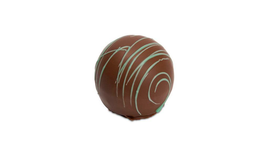 Mint Truffle · Cool and creamy milk chocolate peppermint center in a rich milk chocolate shell.