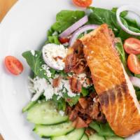 Spinach Salmon Salad · Grilled salmon, diced bacon, red onions, spinach, tomatoes, feta cheese and honey mustard dr...