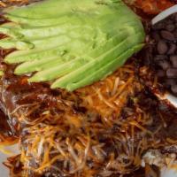 Mole Enchiladas · Filled with brown rice, tomato, and avocado. Topped with cheddar cheese. Served with black b...