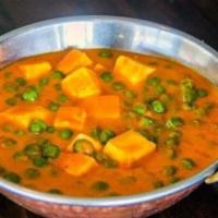 Matar Paneer · Peas and curd cheese in curry sauce.