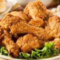 Fried Chicken Legs · (Eight pieces) marinated then coated in a garlic pepper seasoning and fried golden
