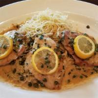 Chicken Piccata · Spaghetti pasta mixed with diced chicken, capers, and onions in a lemon butter garlic sauce
