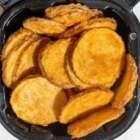 Potato Fritters · (Serves 4-6) fresh cut potato sliced thin, coated in a garlic pepper seasoning, and fried go...