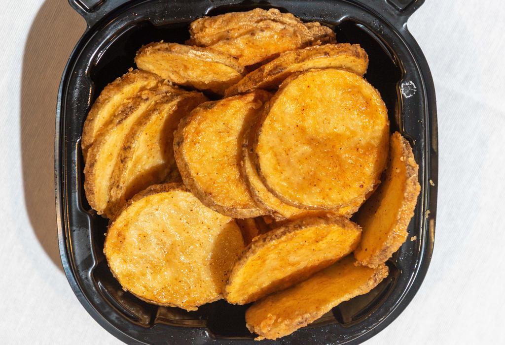 Potato Fritters · Fresh cut potato sliced thin, coated in a garlic pepper seasoning, and fried golden