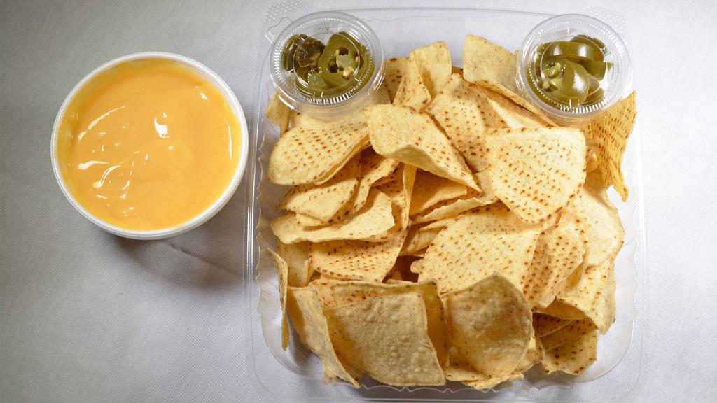 Nachos · Vegetarian. Chips and cheese with a side of jalapenos