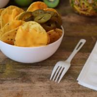 Nachos · Our melted cheese has zero trans-fat and crunchy tortillas chips with sliced jalapeños upon ...