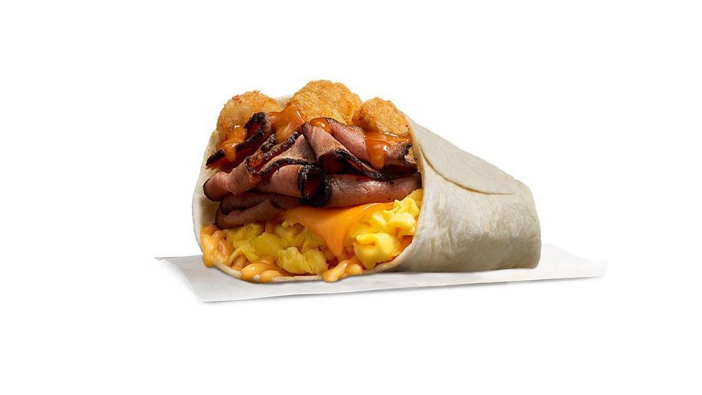 Primal Burrito · Slow cooked sliced prime rib, with hash rounds, smoked cheddar, scrambled eggs, sweet n savory Amber Sauce topped with melted shredded cheese served on a warm tortilla. .