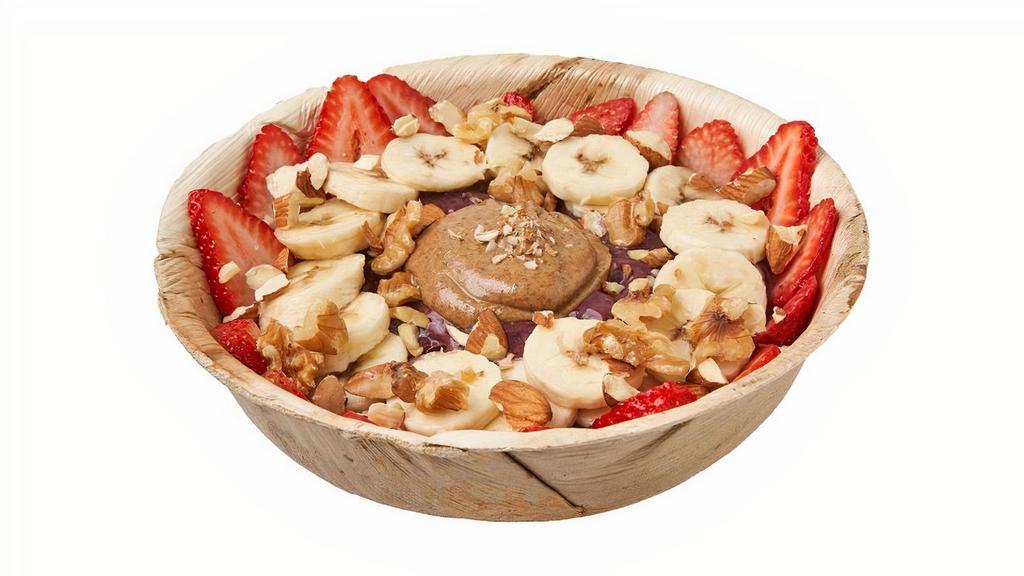 Acai - Protein Bowl · • Base:  Amazonian acai, banana, vanilla protein.. • Toppings:  Banana, strawberries, almonds, walnuts, almond butter.